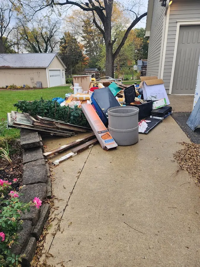 Dumpster being loaded with debris for Demolition Dumpster Rental in El Dorado